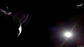 a shimmer of light appears among a screen of black on the bottom right.