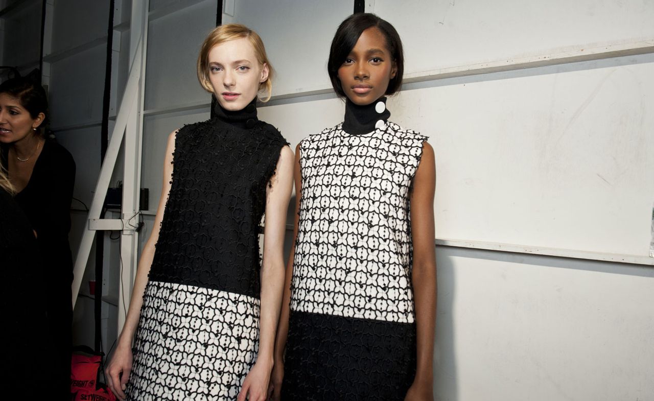 Edun models wearing black and white