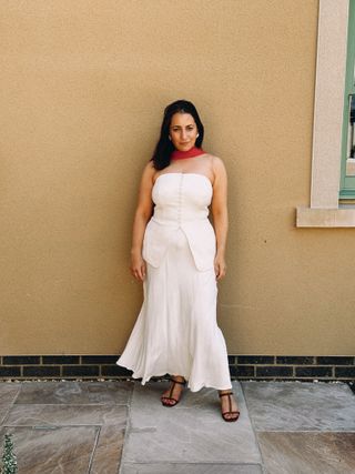 Who What Wear's Editor in Chief, Hannah Almassi wears a Mint Velvet top and skirt set