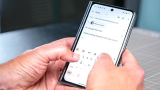 Google Pixel Fold typing on cover display