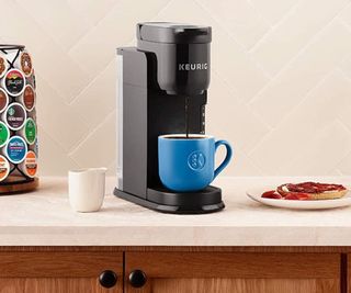 Keurig K-Express with a blue mug underneath