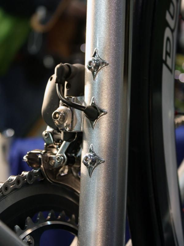 Rather than keep the wire entry and exit points quiet and unobtrusive, Cherubim chose to make them a design feature.