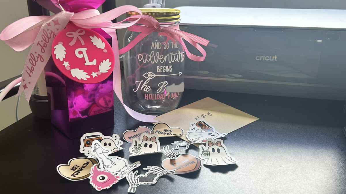 Various projects made by Lucy Scotting with the Cricut Maker 4, including Stickers, box, ornament and card envelope
