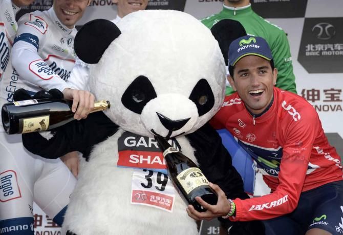 Couldn't have done it without you. Benat Intxausti (Movistar) shares the spoils of success at the Tour of Beijing.