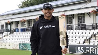 Cricket player holding a bat featuring OnlyFans logo