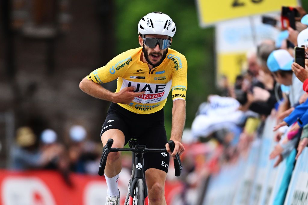 BLATTEN SWITZERLAND JUNE 14 EDITORS NOTE Alternate crop Adam Yates of The United Kingdom and UAE Team Emirates Yellow leader jersey crosses the finish line as second place during the 87th Tour de Suisse 2024 Stage 6 a 425km stage from Ulrichen to Blatten 1330m UCIWT on June 14 2024 in Blatten Switzerland Photo by Tim de WaeleGetty Images