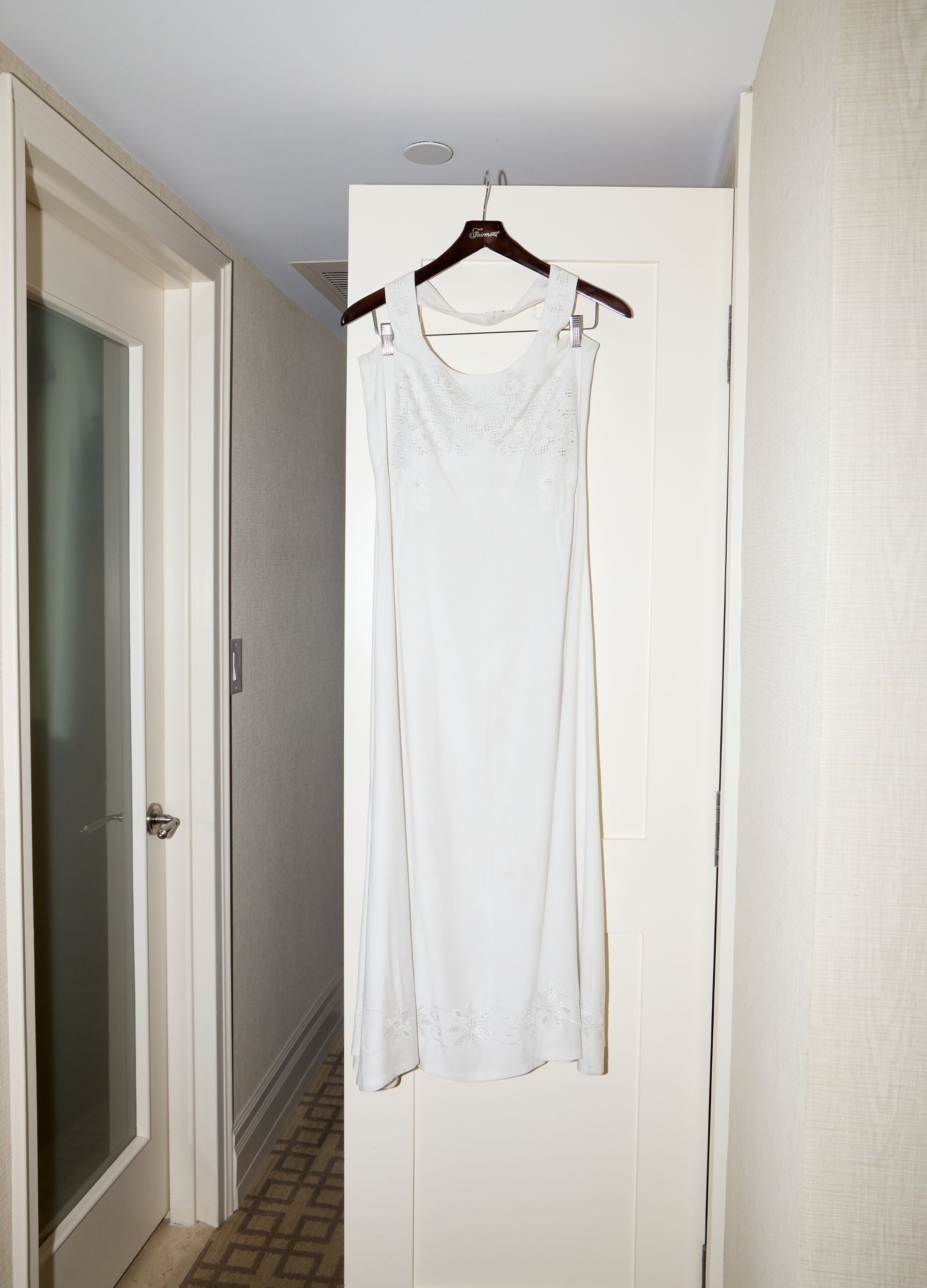 Sophie Telegadis's TIFF premiere dress hanging from her closet door.