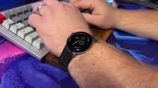 Google Pixel Watch 2 on wrist while typing