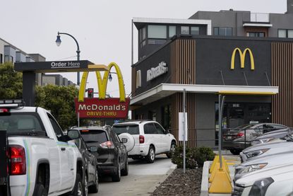 Cars in drive-thru line at McDonald's.