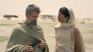 Matt Damon and Zendaya as Odysseus and Athena walking together on the beach in The Odyssey