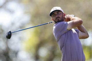 Max Homa hits a tee shot with a driver