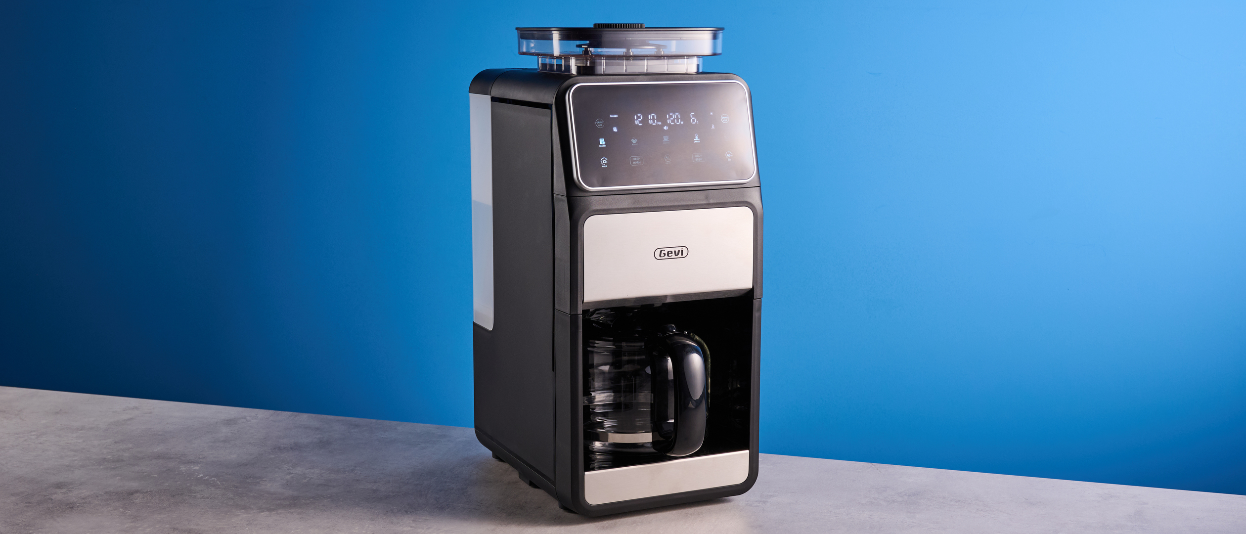 the gevi 10-cup drip coffee maker with grinder photographed against a blue background, showing the glass carafe, water tank, touch screen, and accessories including plastic filter