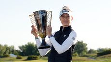 Nelly Korda holding the Mizuho Americas Open trophy