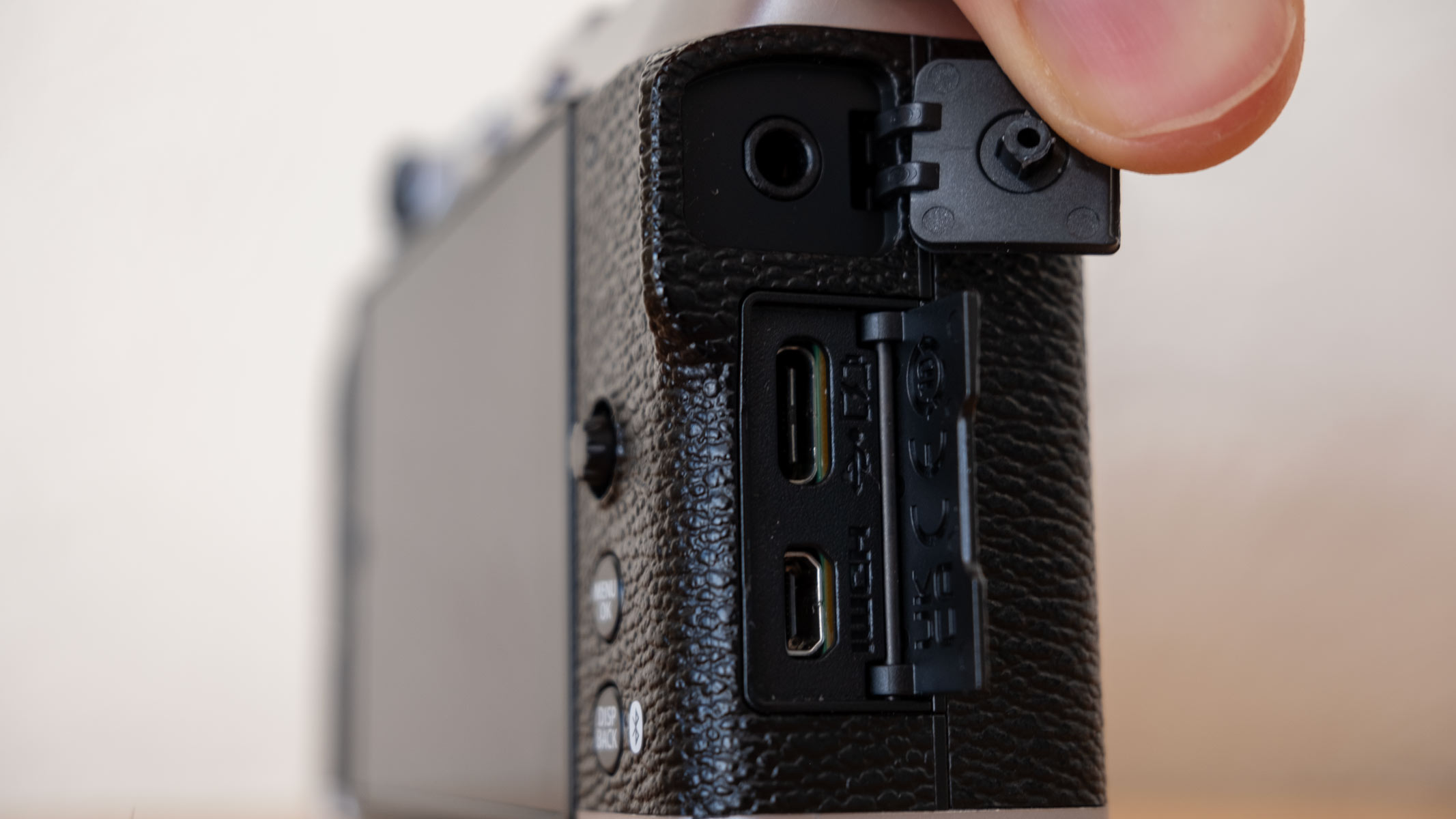 The mic jack, USB-C and mini HDMI port on the side of the Fujifilm X-M5.