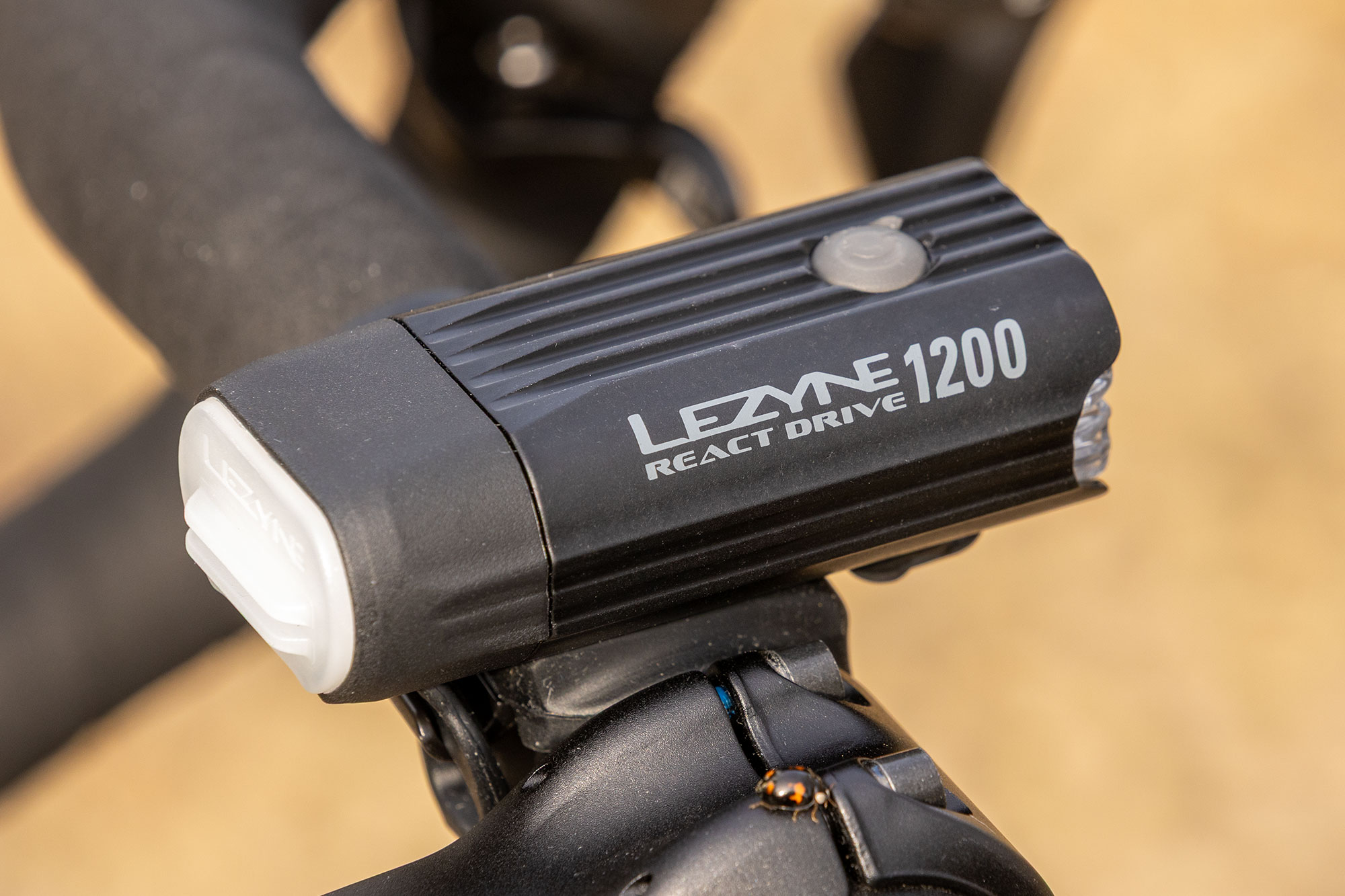 React Drive Front light, pictured side-on slightly from the rear to show illuminated panel