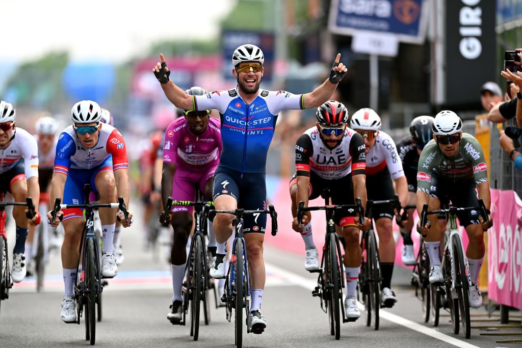 BALATONFURED HUNGARY MAY 08 Mark Cavendish of United Kingdom and Team QuickStep Alpha Vinyl celebrates winning ahead of Arnaud Demare of France and Team Groupama FDJ Hailu Biniam Girmay of Eritrea and Team Intermarch Wanty Gobert Matriaux purple points jersey Fernando Gaviria Rendon of Colombia and UAE Team Emirates and Jakub Mareczko of Italy and Team Alpecin Fenix during the 105th Giro dItalia 2022 Stage 3 a 201km stage from Kaposvr to Balatonfred Giro WorldTour on May 08 2022 in Balatonfured Hungary Photo by Stuart FranklinGetty Images