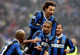 Inter Milan's forward Adriano (C) is congratulated by his teammates (From L) Maicon, Zlatan Ibrahiomovic and Dejan Stankovic after scoring a goal against Fiorentina during their Italian serie A football match at San Siro stadium in Milan, 21 January 2007