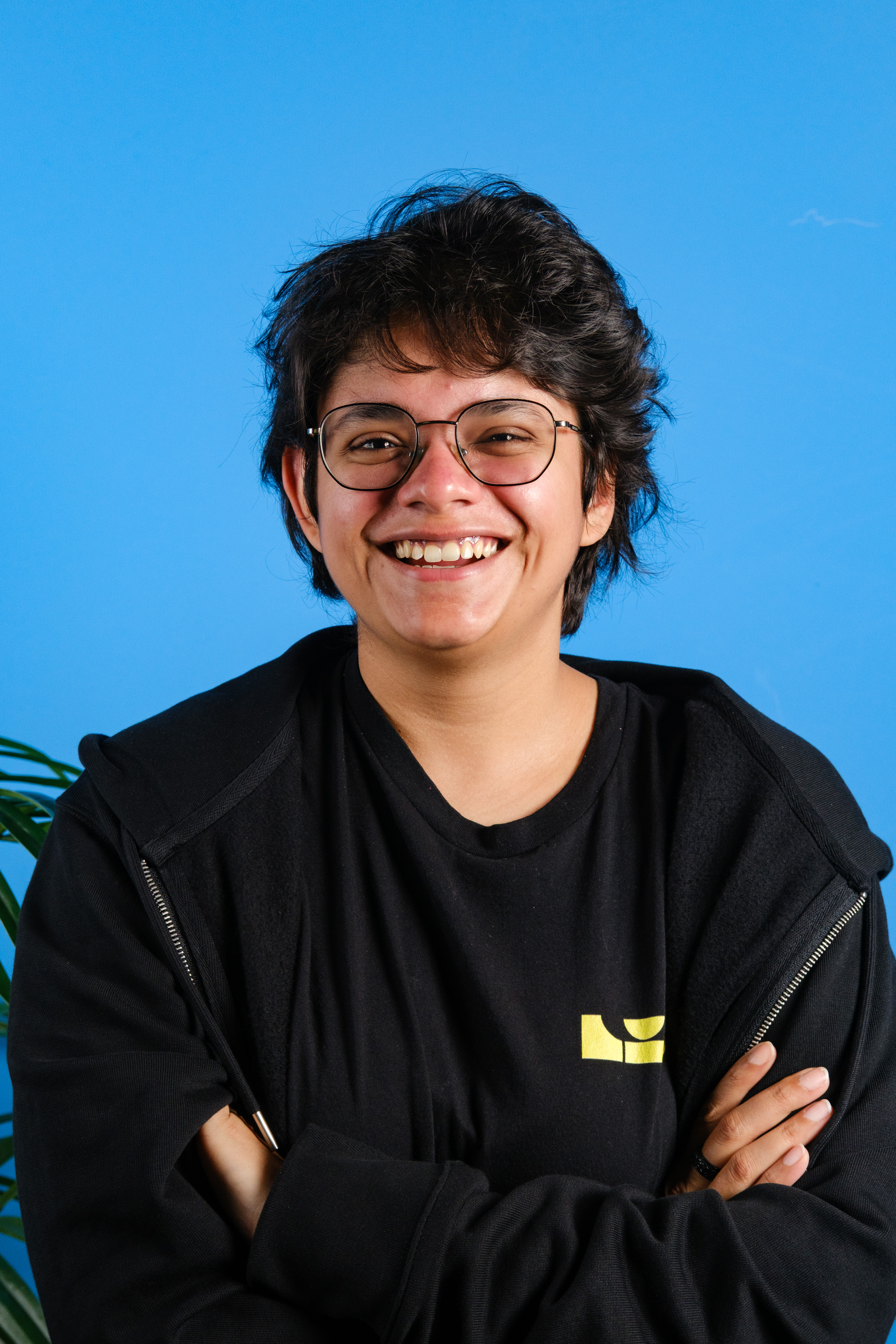 A color photograph of Tom's Guide staff writer Nikita Achanta, against a blue background.