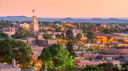 An aerial view showing downtown Santa Fe, New Mexico, at dusk
