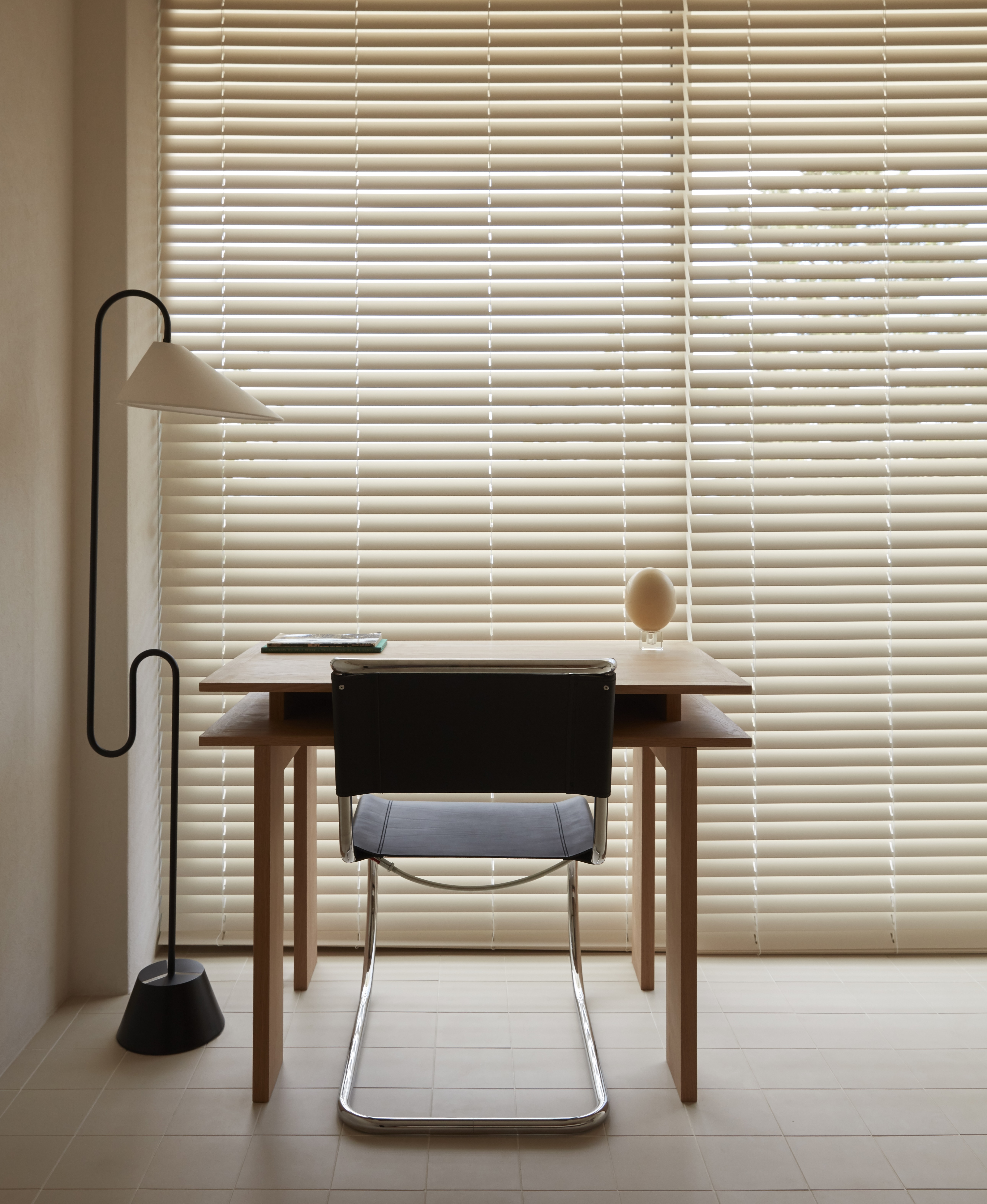 A home office with Venetian blinds