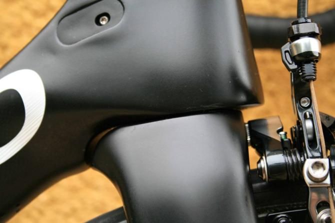 A slight nosecone has been built onto the head tube and the fork crown is integrated into the down tube &ndash; a hangover from the 65.1