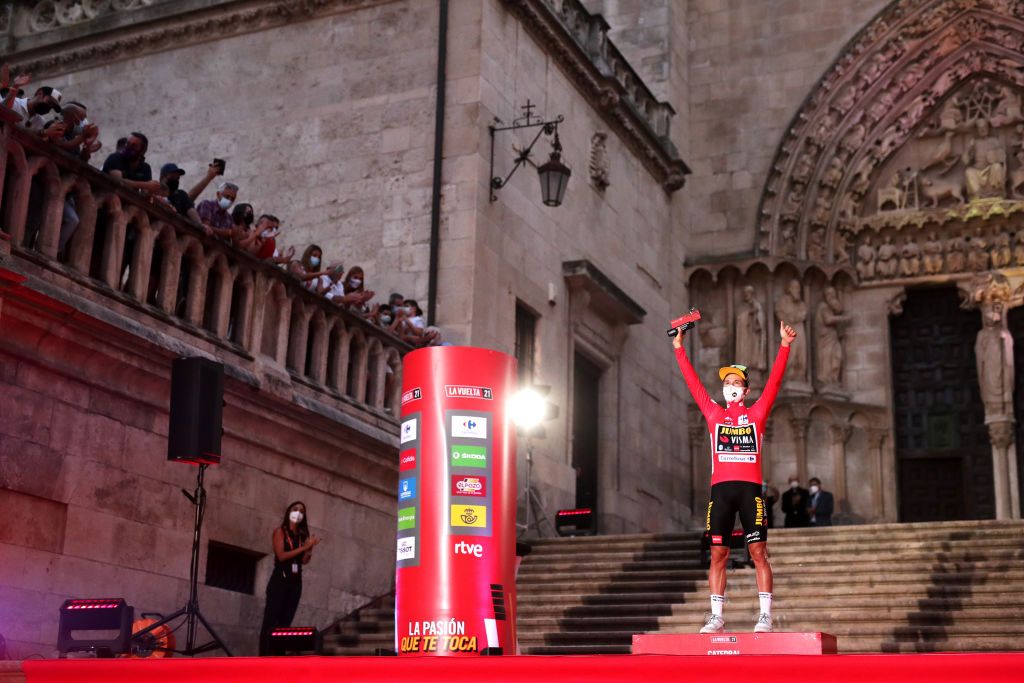 BURGOS SPAIN AUGUST 14 Primoz Roglic of Slovenia and Team Jumbo Visma celebrates at podium as Red Leader Jersey during the 76th Tour of Spain 2021 Stage 1 a 71km individual time trial from Burgos Catedral de Santa Mara to Burgos lavuelta LaVuelta21 CapitalMundialdelCiclismo catedral2021 on August 14 2021 in Burgos Spain Photo by Gonzalo Arroyo MorenoGetty Images