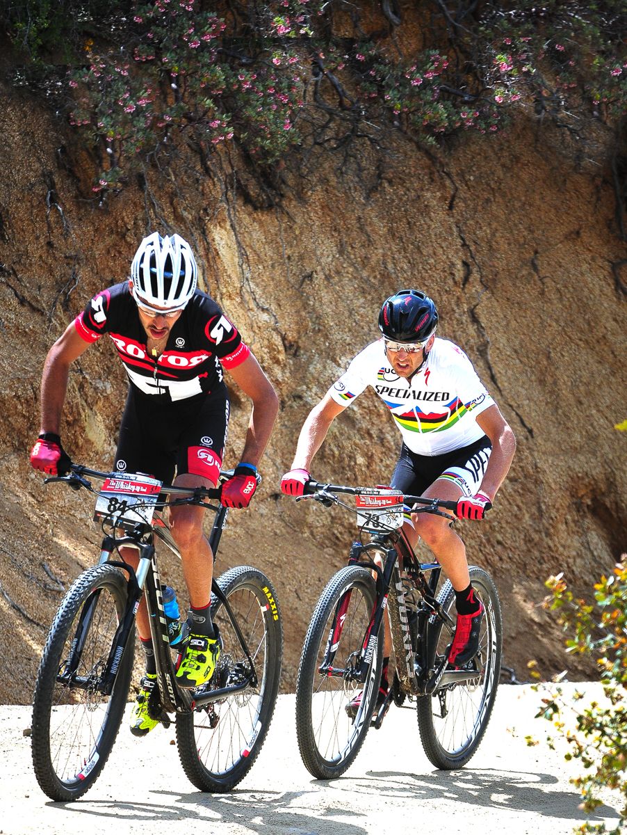Fernando Paez (Raleigh Clement) leads Christoph Sauser (Specialized) on the climb out of Skull Valley during the 2014 race