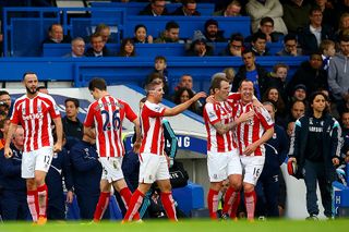 LONDON, ENGLAND - APRIL 04: Charlie Adam of Stoke City celebrates with team-mates after scoring his team's first goal during the Barclays Premier League match between Chelsea and Stoke City at Stamford Bridge on April 4, 2015 in London, England. (Photo by Richard Heathcote/Getty Images)