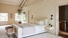 A clean, zen bedroom with cream and beige accents 