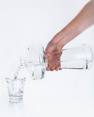 Bottle with water and glass