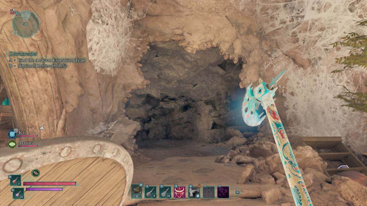 A cave entrance in Avowed that had spiderwebs on it.