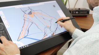 Wacom Bridge; a person draws a car on a pen display