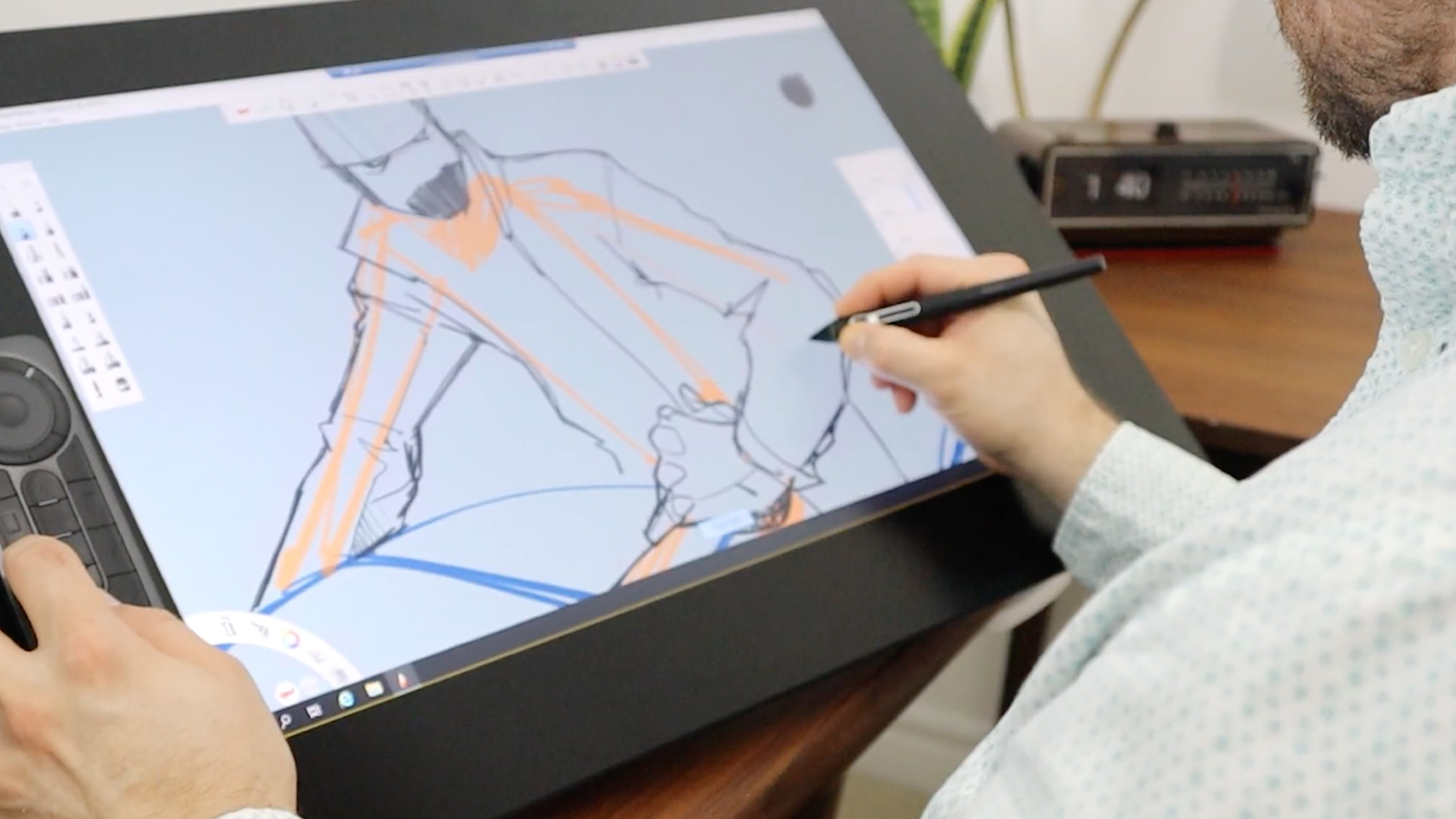 Wacom Bridge; a person draws a car on a pen display