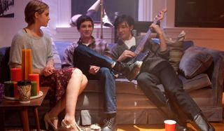 The Perks of Being A Wallflower Emma Watson sits with Logan Lerman and Ezra Miller at a party