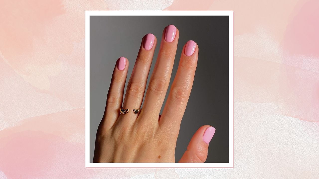 Hand with short candy pink nails