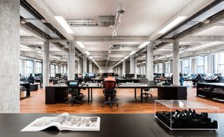 An open plan workspace sits at the centre of the design