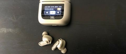 JBL Tour Pro 2 earbuds and case on navy background