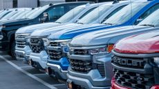A line of cars at the dealership.