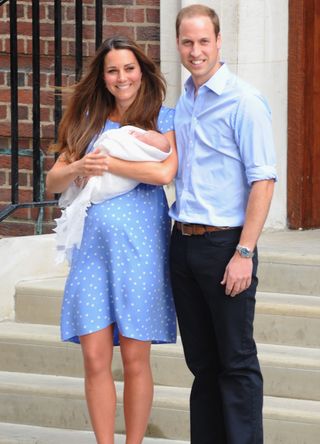 Prince William and Kate Middleton with a baby Prince George in 2013