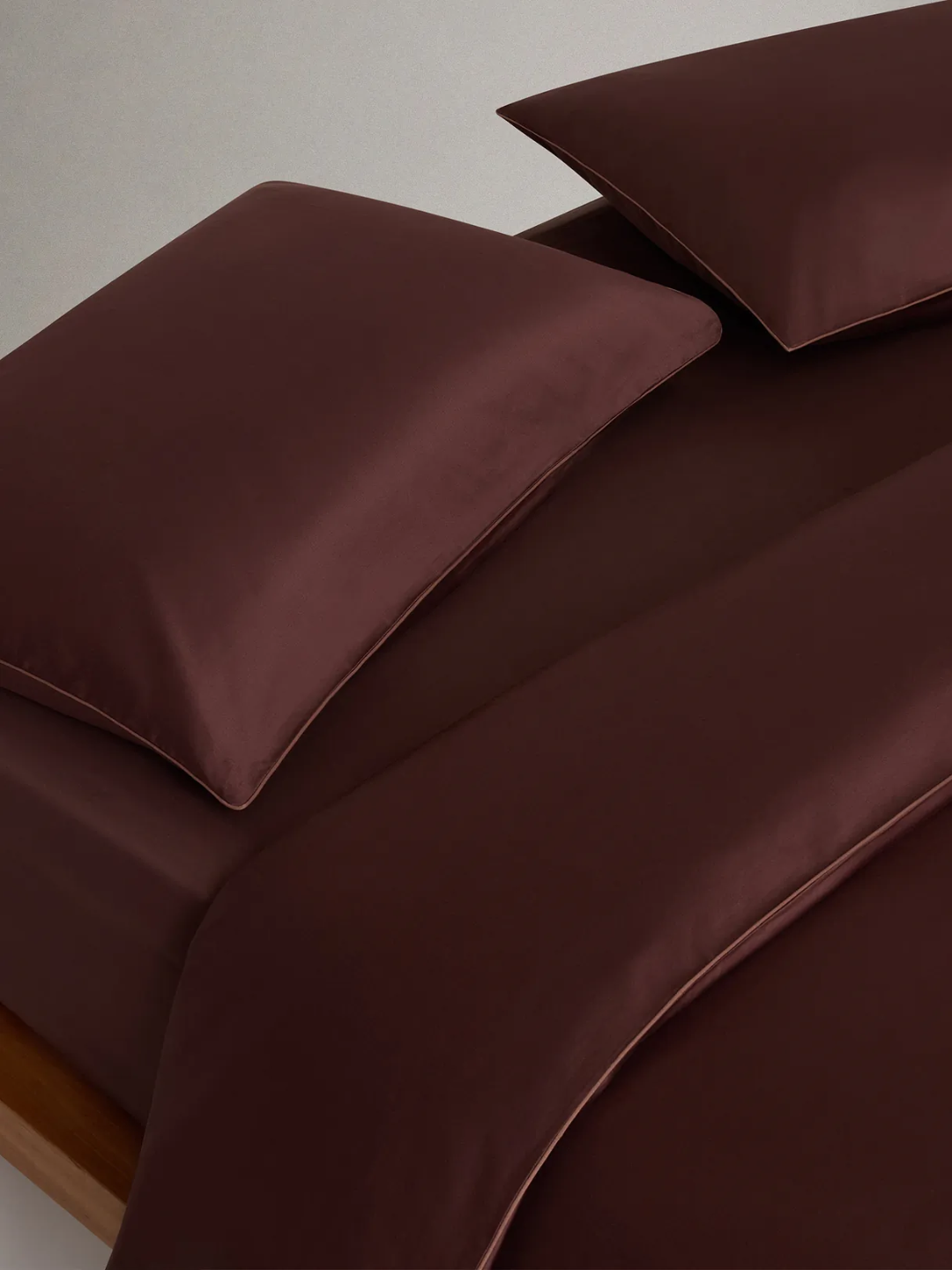 A deep brown-burgundy cotton sateen duvet set from Rise &amp;amp; Fall