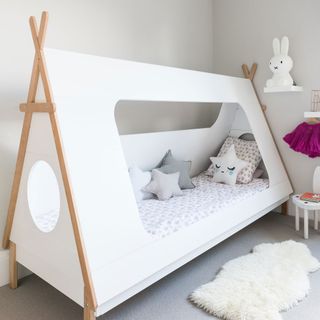 childs room with tent bed and bunny