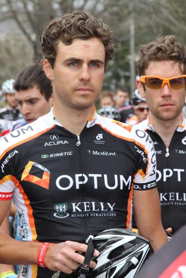 Jesse Anthony (Team Optum Presented by Kelly Benefit Strategies) removes his helmet for the National anthem