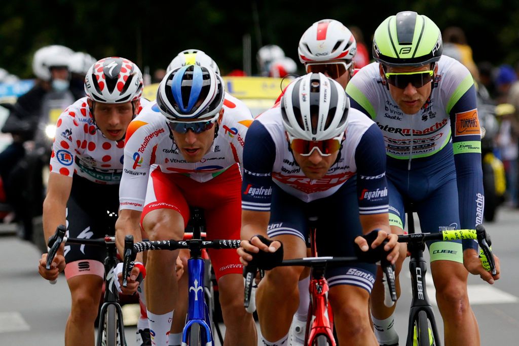 From L Breakaway riders Team Bora Hansgrohes Ide Schelling of Netherlands wearing the best climbers polka dot jersey Team Total Energies Jeremy Cabot of France Team Trek Segafredos Edward Theuns of Belgium and Team Intermarche Wantys Jonas Koch of Germany ride ahead during the 2nd stage of the 108th edition of the Tour de France cycling race 183 km between PerrosGuirrec and Mur de Bretagne Guerledan on June 27 2021 Photo by Thomas SAMSON AFP Photo by THOMAS SAMSONAFP via Getty Images