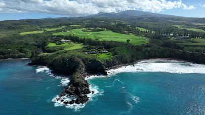 An aerial view of the golf course from over the ocean prior to The Sentry at The Plantation Course at Kapalua on December 31, 2023 in Kapalua, Maui, Hawaii