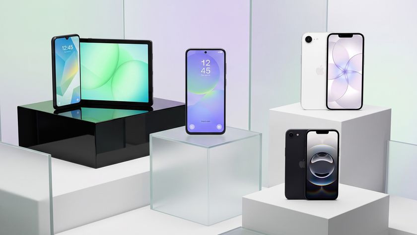 A selection of Apple and Samsung smartphones on a glassy background.