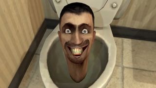 A grinning head in a toilet