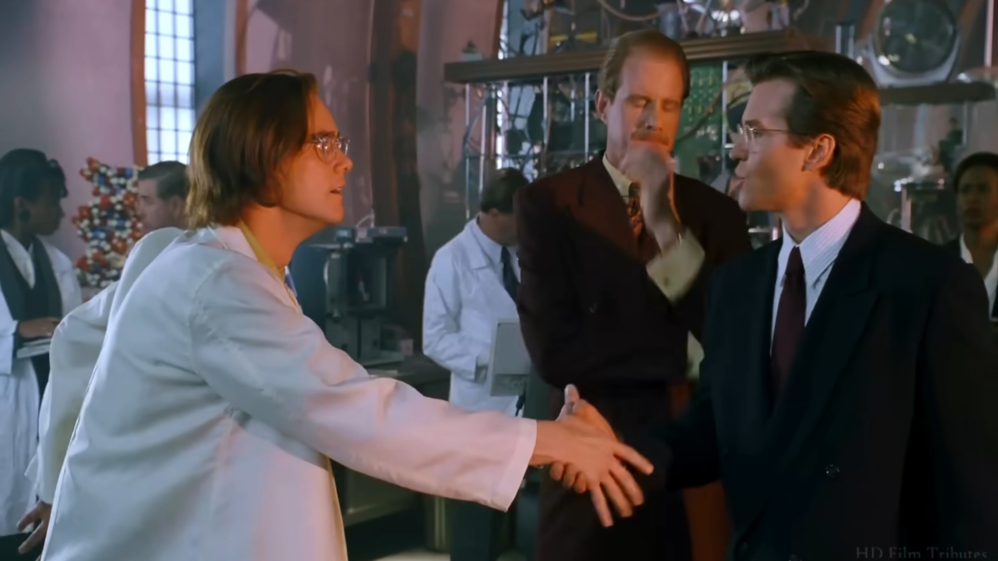 Jim Carrey shaking Val Kilmer's hand in Batman Forever
