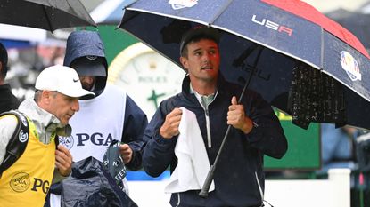 Bryson DeChambeau under an umbrella at the PGA Championship