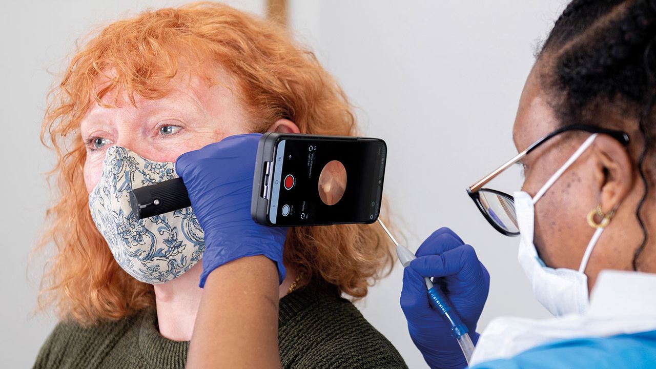 Woman having an ear inspection