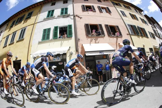 The Giro peloton rolls out of Sansepolcro at the start of stage 9